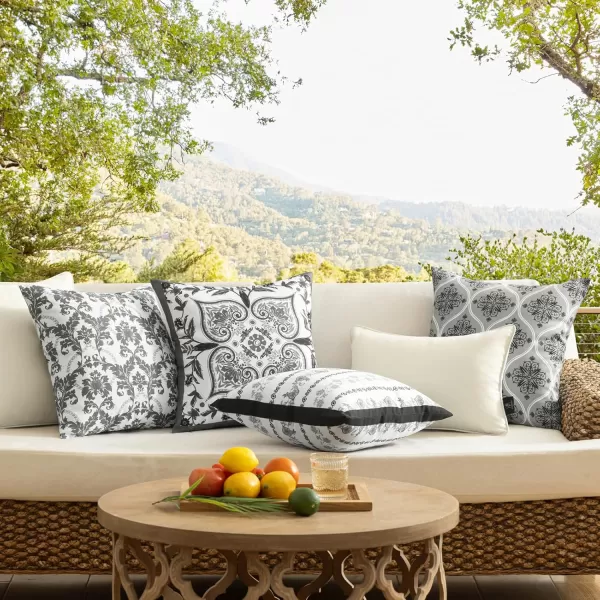 Phantoscope Pack of 4 Outdoor Pillows Waterproof Boho Geometric Outdoor Throw Pillow Covers Decorative Floral Patio Pillows Square Cushion Case for Couch Tent Sunbrella OrangeBlue 18x18 InchesBlackWhite