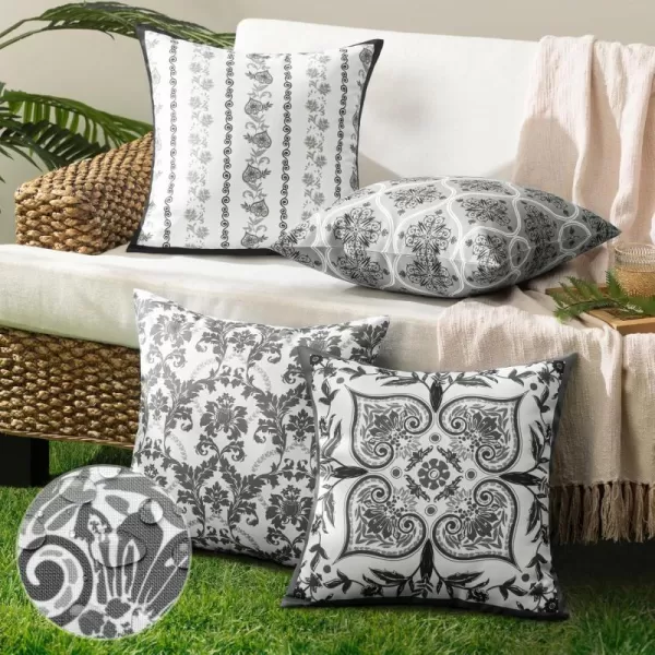 Phantoscope Pack of 4 Outdoor Pillows Waterproof Boho Geometric Outdoor Throw Pillow Covers Decorative Floral Patio Pillows Square Cushion Case for Couch Tent Sunbrella OrangeBlue 18x18 InchesBlackWhite