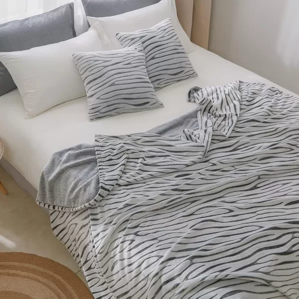 imageFY FIBER HOUSE Flannel Fleece Throw Blanket Lightweight Cozy Plush Microfiber Bedspreads for Adults60quotX80quotBrown LeopardBlack Zebra
