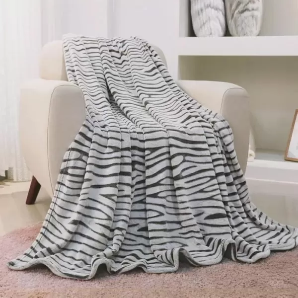 imageFY FIBER HOUSE Flannel Fleece Throw Blanket Lightweight Cozy Plush Microfiber Bedspreads for Adults60quotX80quotBrown LeopardBlack Zebra