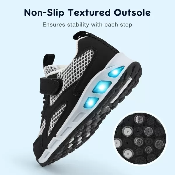 imageLight Up Toddler Boys Girls Shoes LED Flashing Lightweight Tennis Walking Sneakers for Toddler and Little KidBlackWhite Kids Light Up Shoes