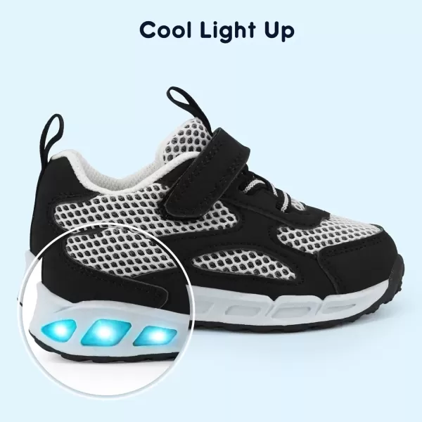 imageLight Up Toddler Boys Girls Shoes LED Flashing Lightweight Tennis Walking Sneakers for Toddler and Little KidBlackWhite Kids Light Up Shoes
