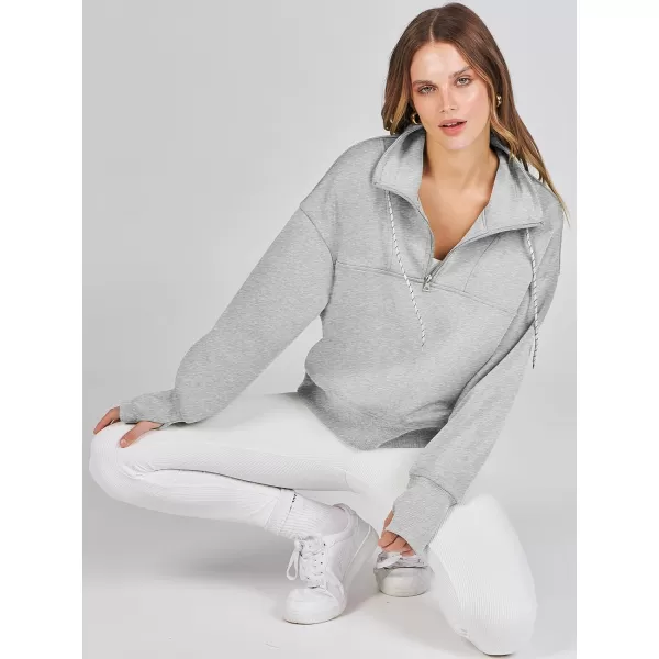 Caracilia Womens Half Zip Loose Sweatshirt Quarter Zip Trendy Long Sleeve Cropped Pullover Tops with Thumb Hole