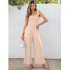 imageCaracilia Womens Jumpsuit Sleeveless Casual Dressy Smocked Wide Leg Rompers Summer Vacation Jumpers with Pockets 2025 OutfitsApricot