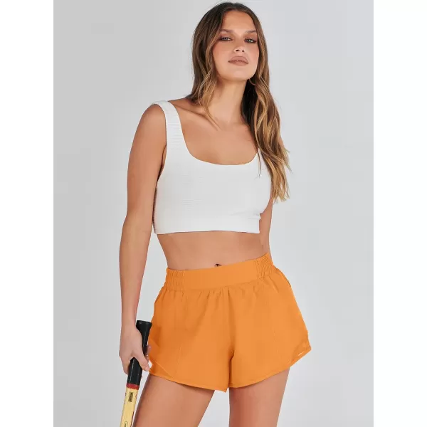 imageANRABESS Running Shorts for Women Quick Dry Athletic Sports Shorts Lightweight Active Workout Gym Shorts with Zip PocketOrange