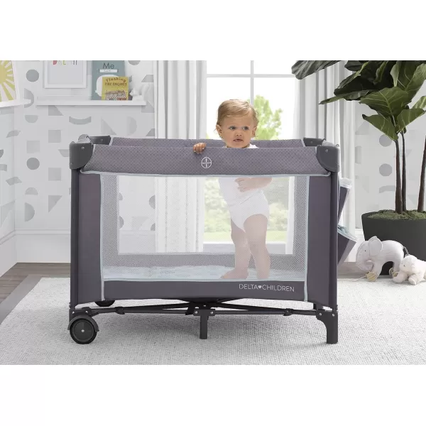 Delta Children LX Deluxe Portable Baby Play Yard With Removable Bassinet and Changing Table, Eclipse