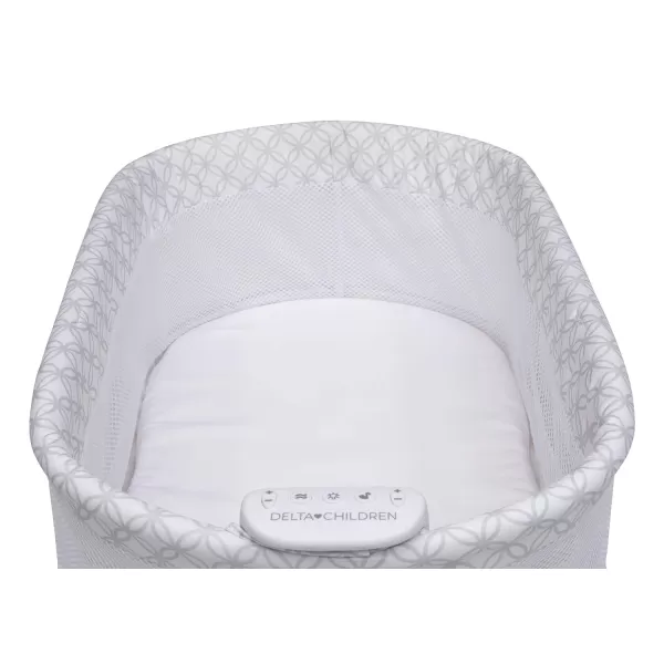 Delta Children Sweet Dreams Bassinet with Airflow Mesh Bedside Portable Crib with Vibration Lights and Music, Grey Infinity