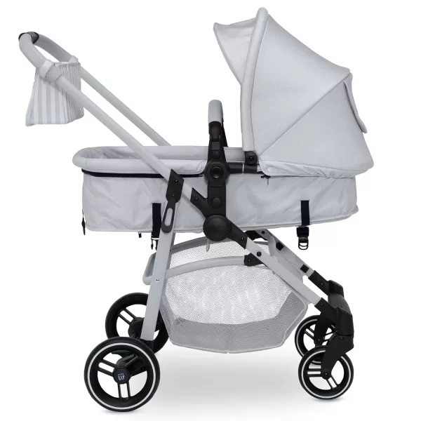 GAP babyGap 2-in-1 Carriage Stroller - Car Seat Compatible - Easy One-Handed Fold - Lightweight Stoller with Oversized Canopy &amp; Reclining Seat - Made with Sustainable Materials, Black Camo