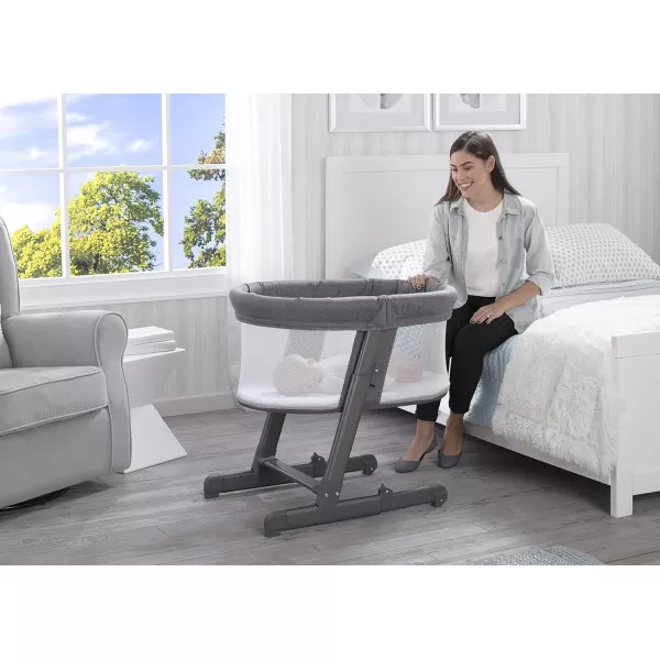 Simmons Kids Oval City Sleeper Bedside Bassinet - Adjustable Height Portable Crib with Wheels &amp; Airflow Mesh, Grey Tweed 31.5x19.7x30 Inch 