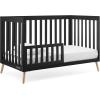imageDelta Children Essex 4in1 Convertible Baby Crib Bianca White with Natural LegsEbony