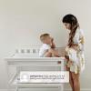 imageDelta Children Flat Top Changing Table with Wheels and Changing Pad  Greenguard Gold Certified GreyBianca White