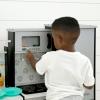 imageDelta Children Gourmet AllinOne Corner Play Kitchen  Toy Kitchen Playset with Safe ampamp Heatless Stove with Lights Oven Sink FridgeFreezer with Ice Maker and 20 Accessories NaturalWhiteGrey