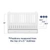 imagebabyGap by Delta Children Graham 4in1 Convertible Crib with Storage Drawer TrueSleep Crib and Toddler Mattress Bundle Bianca White