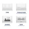 imagebabyGap by Delta Children Graham 4in1 Convertible Crib with Storage Drawer TrueSleep Crib and Toddler Mattress Bundle Bianca White